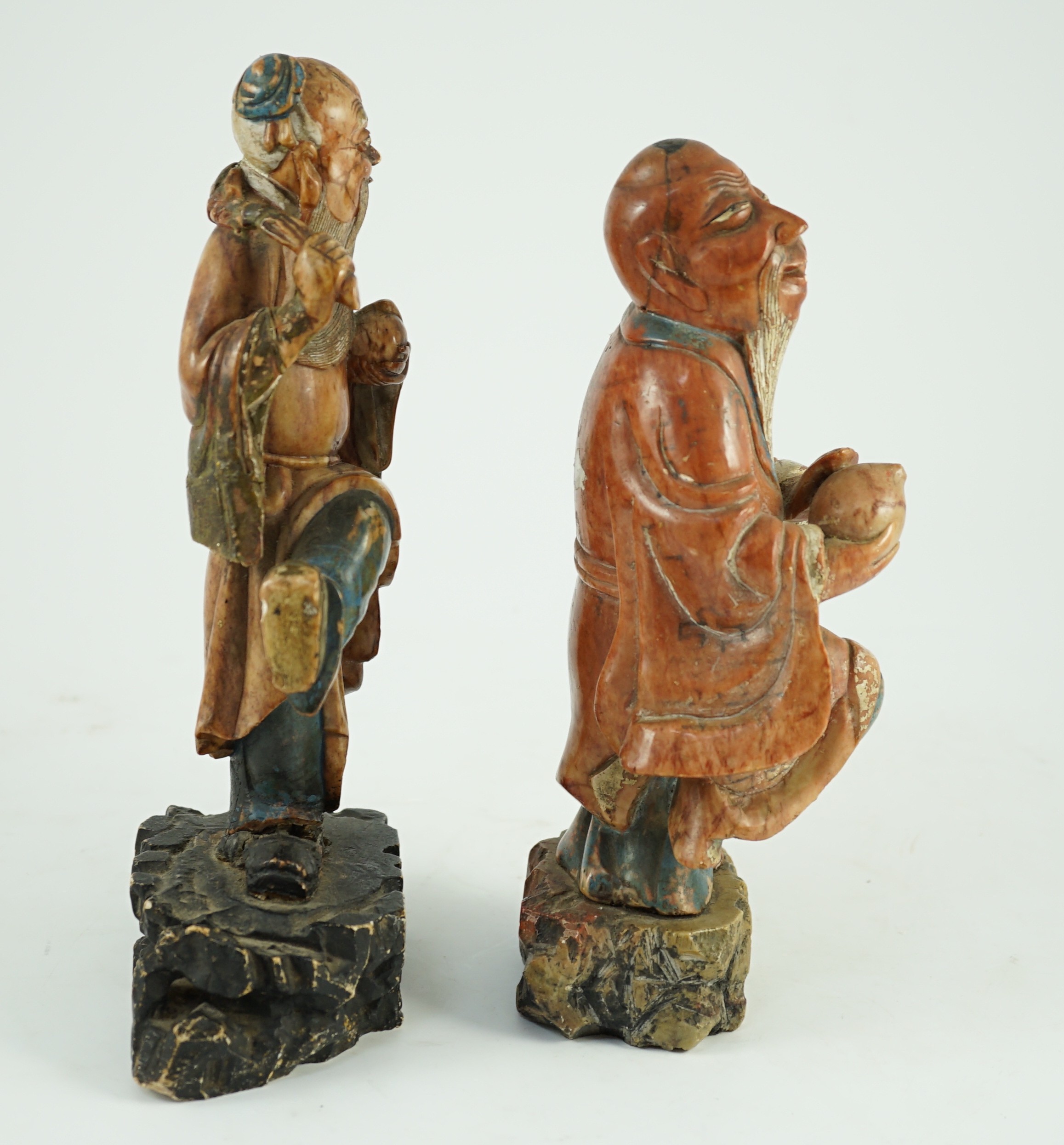 Two Chinese soapstone figures of Shou Lao, 18th century, 23cm and 24.5cm high